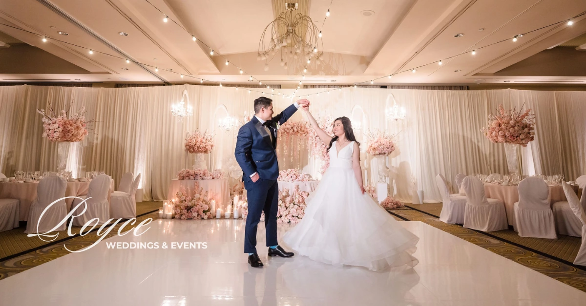 Bride and groom sharing a private dance in reception ballroom at Pacific Palms Resort, styled by wedding planner Los Angeles California.