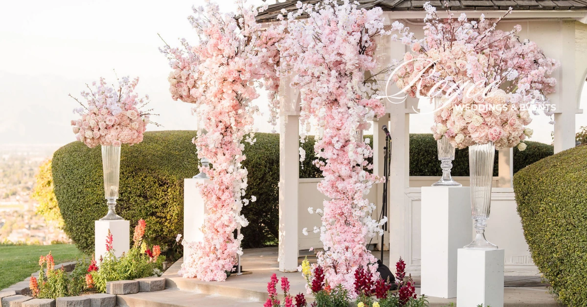 Cherry blossom floral gazebo ceremony setup at Pacific Palms Resort by bilingual Chinese wedding planner LA.