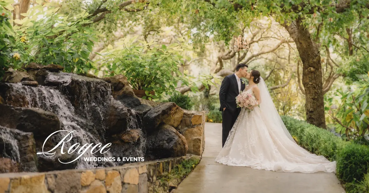 Garden wedding venue California with a romantic couple portrait beside a peaceful waterfall