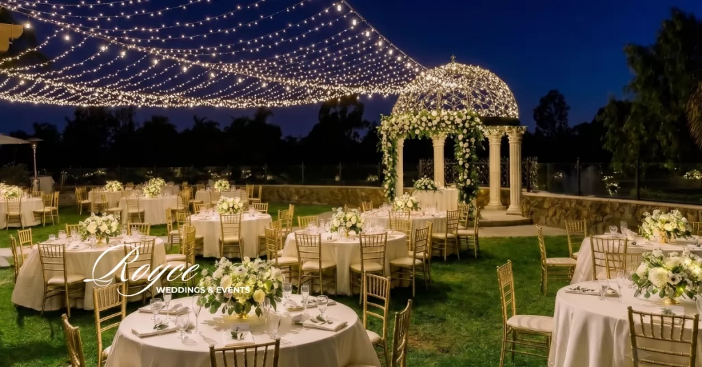 Romantic nighttime reception at Old Ranch Wedding Venue with elegant lighting and floral decor