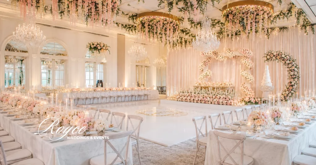 Rosewood Miramar Wedding Chandelier Ballroom reception with luxury floral design and elegant tablescape