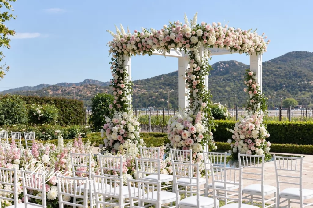 Four Seasons Wedding Guide showcasing a fairytale outdoor wedding ceremony surrounded by romantic garden florals