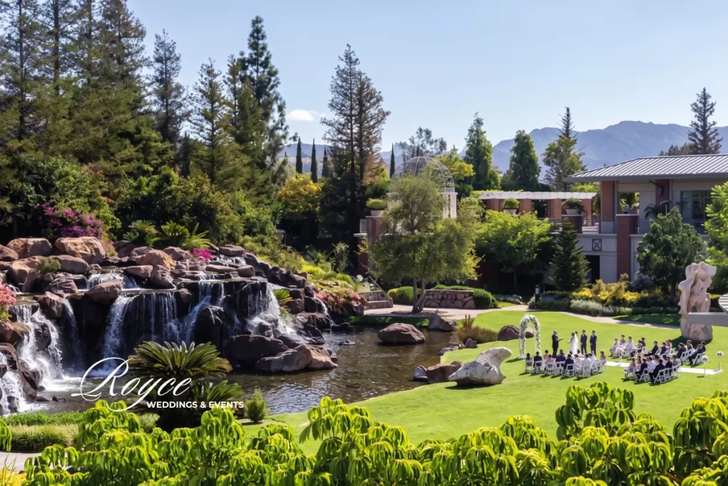 Four Seasons Westlake Wedding aerial view with waterfall, lush gardens, and elegant outdoor ceremony