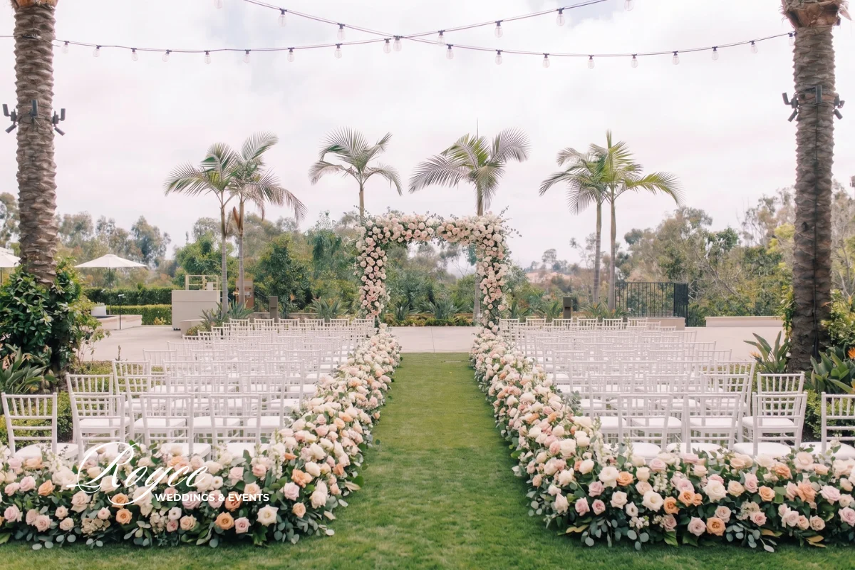 Park Hyatt Aviara Wedding outdoor ceremony at Palm Court with towering palms and elegant florals