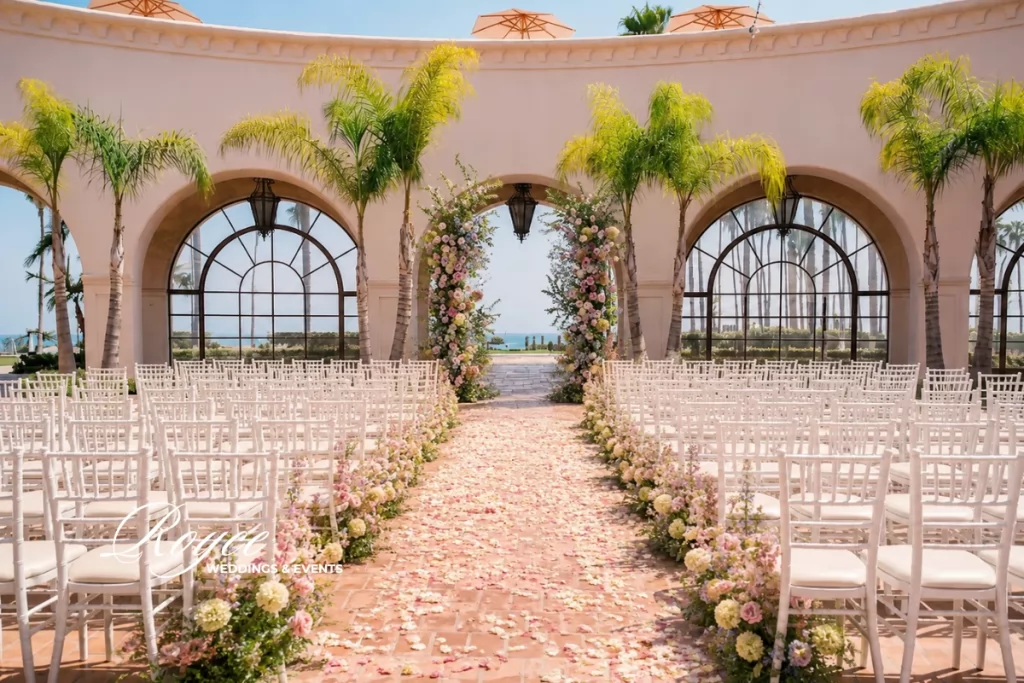 Santa Barbara wedding ceremony at Plaza del Sol with elegant floral decor and ocean views