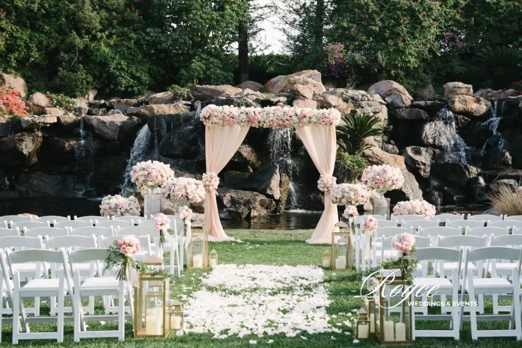 luxury Westlake Village outdoor wedding ceremony at Waterfall Lawn with cascading waterfall backdrop