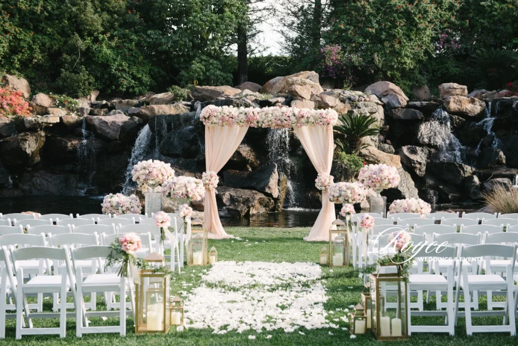 Elegant outdoor wedding ceremony at Four Seasons Westlake, planned by top Los Angeles wedding planners Royce Weddings & Events.