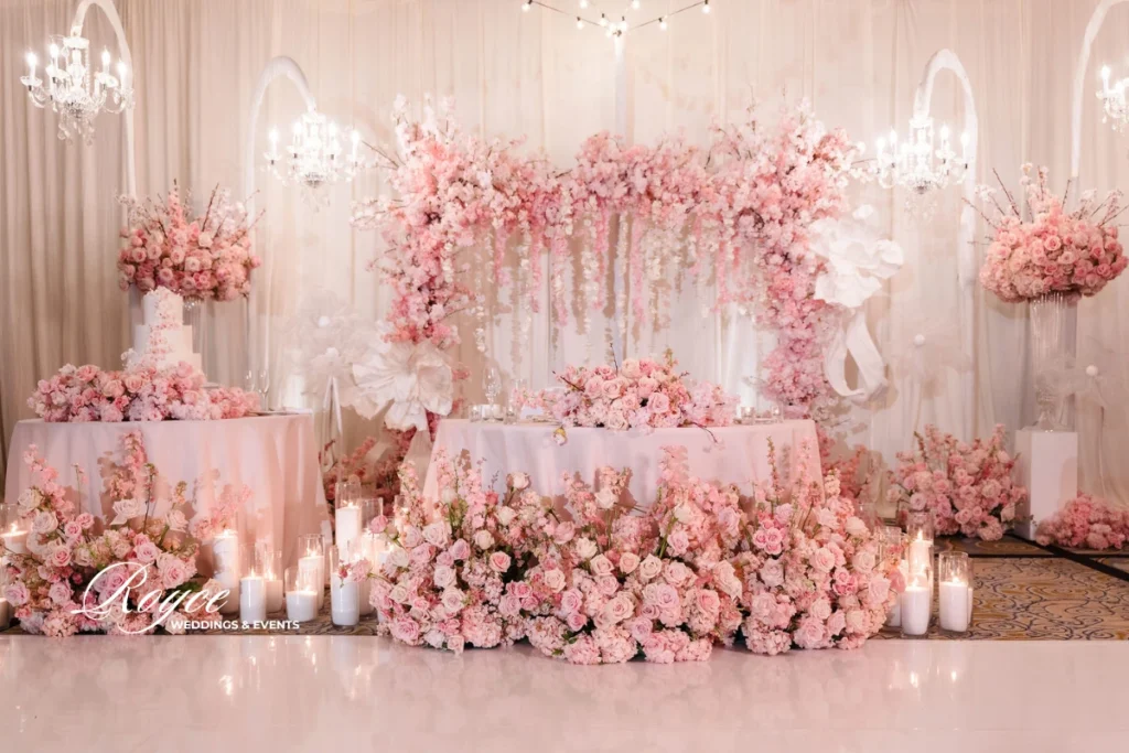Cherry blossom themed wedding cake and dessert display at Pacific Palms Resort, by premier Los Angeles wedding planners.