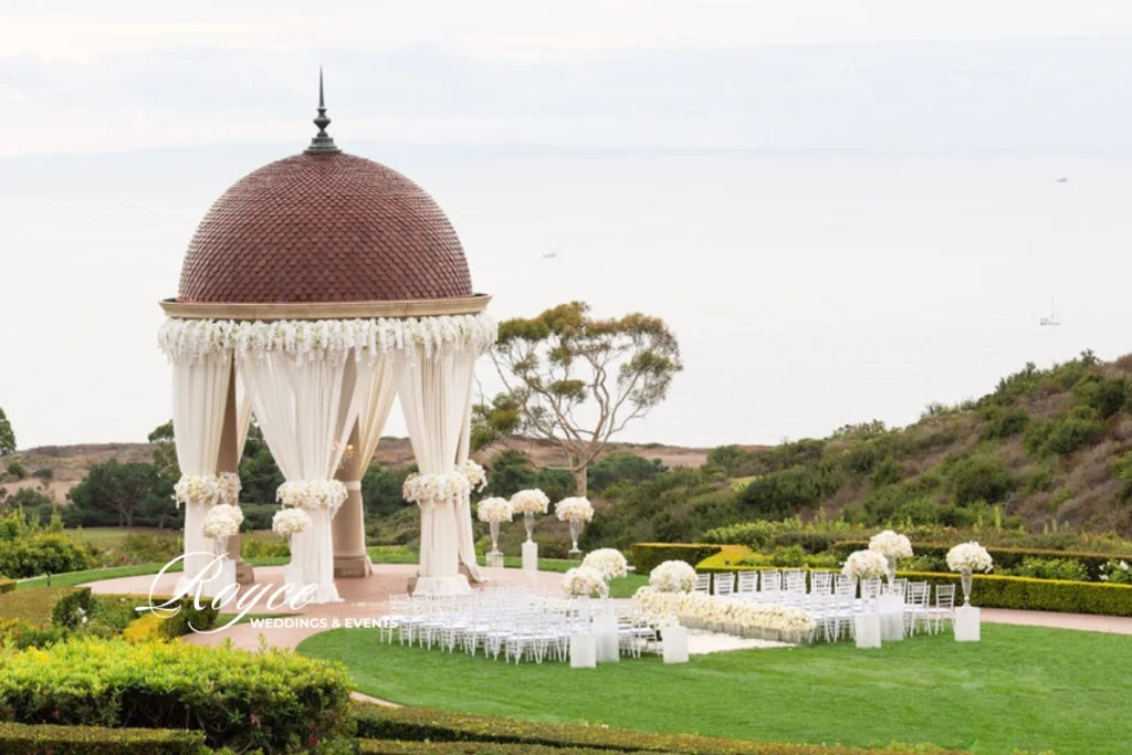 Ivory toned wedding ceremony at Pelican Hill, styled with timeless elegance by Royce Weddings & Events.